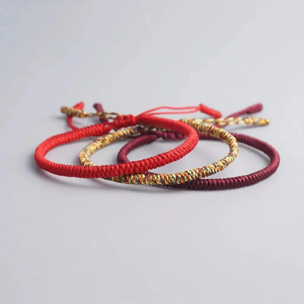 Artisan d'Asie Bracelets Tressés Tibétains Bracelet tibétain tressé à la main rouge, rouge foncé et jaune multicolore