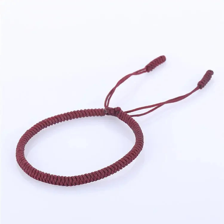 Artisan d'Asie Bracelets Tressés Tibétains Rouge Foncé Bracelet tibétain tressé à la main rouge, rouge foncé et jaune multicolore