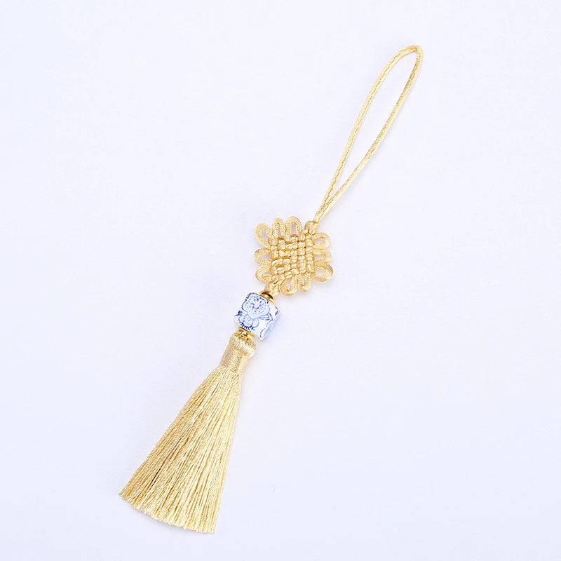 Artisan d'Asie Feng Shui Or Clair Nœud sans fin en porcelaine Feng Shui chinoise