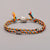 Bracelet Tibétain tressé à la main multicolore avec une amulette aux choix Bracelets Tressés Tibétains Artisan d'Asie 