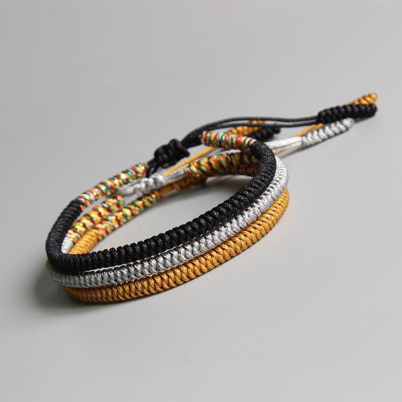 Black, gold and gray hand braided Tibetan bracelet