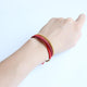 Bracelet tibétain tressé à la main rouge et or Bracelets Tressés Tibétains Artisan d'Asie