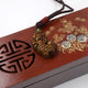 Pendentif Feng Shui Pixiu en Oeil de Tigre Pendentifs & Amulettes Artisan d'Asie